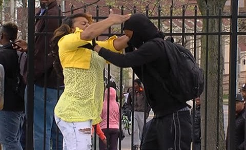 Raw: Woman Confronts Baltimore Protester
