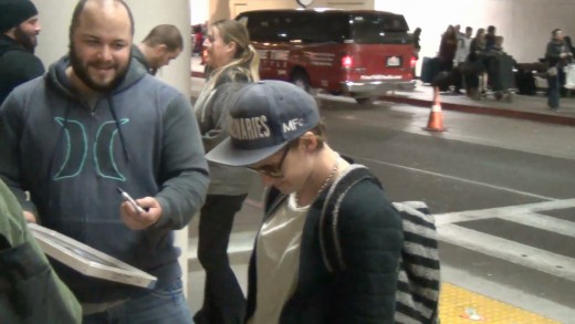 Kristen Stewart and Alicia Cargile leaving LAX Airport and cusing a lot