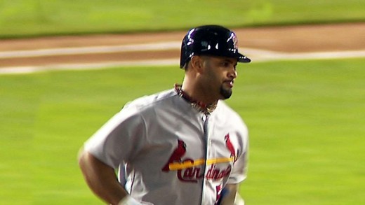 Pujols hits a trio of homers in World Series