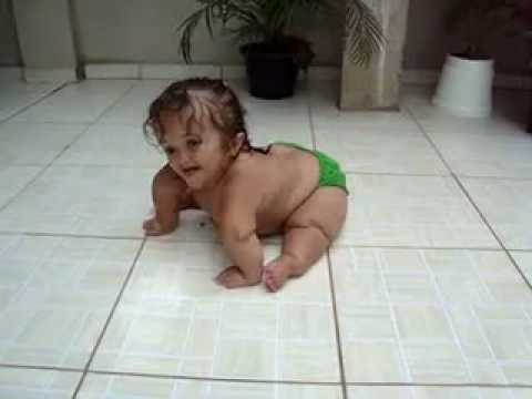 cute weird baby slides around on tiles