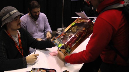 Jake Lloyd signs my Turbo Man action figure at Star Wars Celebration VI