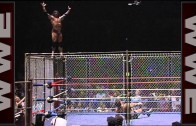 Jimmy Snuka dives off the top of  the steel cage!